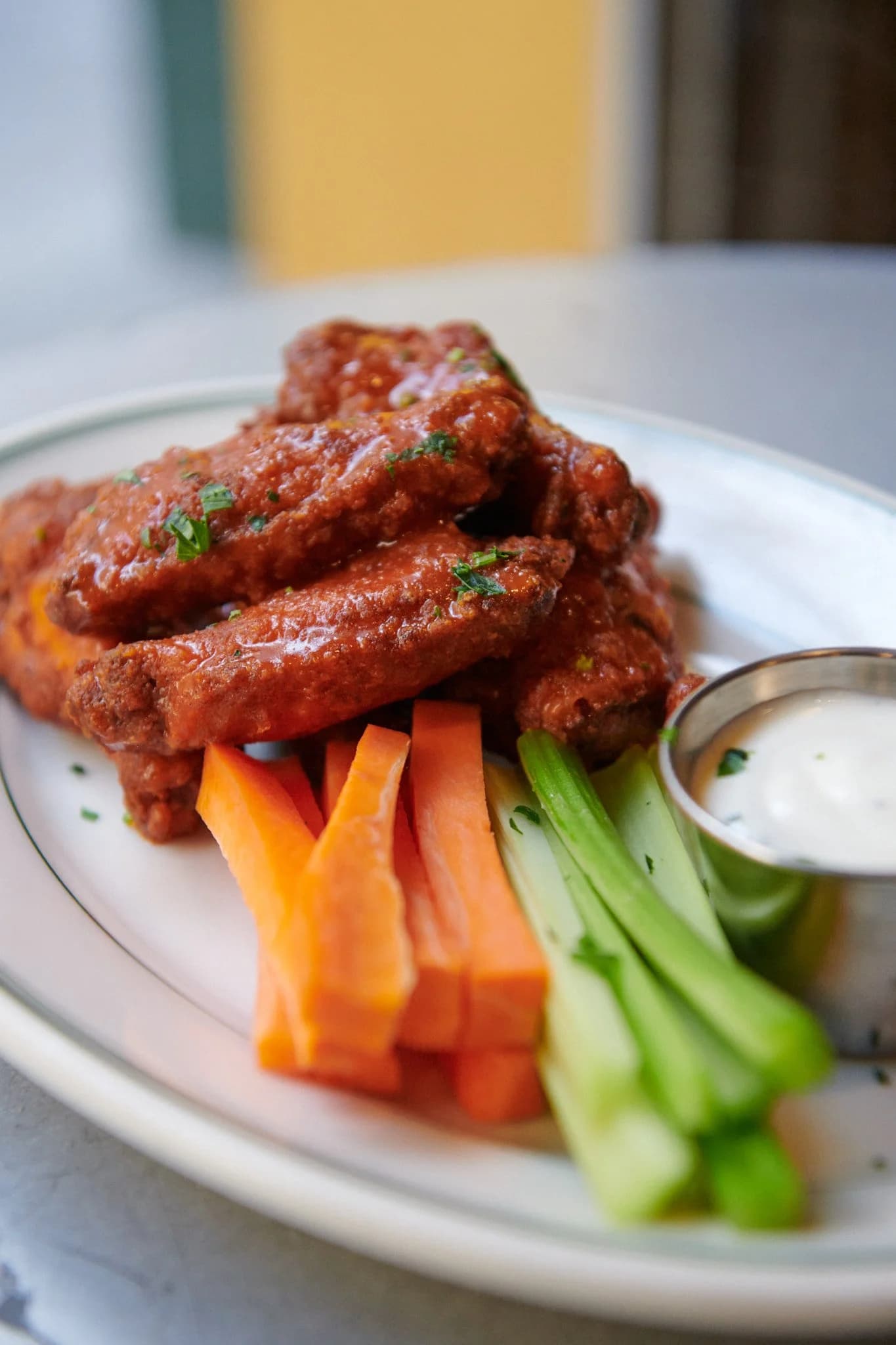 Buffalo wings with celery, carrots and blue cheese